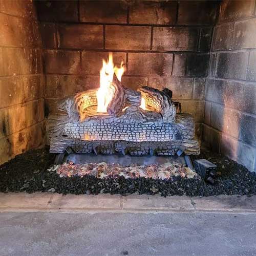  Stock photo of new gas logs after installation.  Nice fire burning and the logs have the charred look.