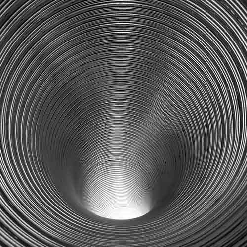 Stock photo of new ribbed chimney liner looking down the inside.