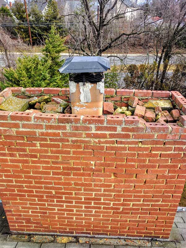 Chimney Repairs - no crown and crumbling brick and cap.