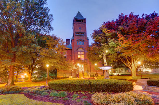 This is the red brick courthouse built in 1891.  It has a beautiful tower at the front entrance and great landscape lighting around the autumn trees.